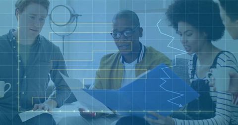 Diverse Team Collaborating with Documents in Modern Workspace