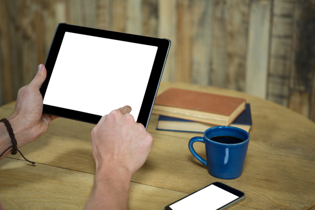 Person Using Tablet with Transparent Screen in Coffee Shop Setting - Download Free Stock Videos Pikwizard.com