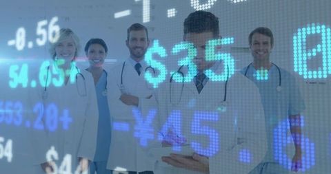 Posing medical team with digital financial market overlay and clinical tablet