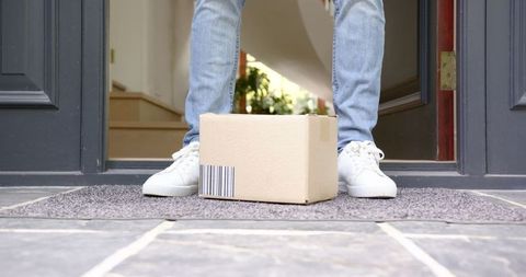 Person Collecting Package at Front Door for Online Delivery - Download Free Stock Images Pikwizard.com