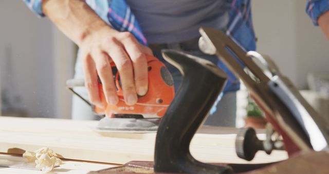 Carpenter Sanding Wood Plank in Workshop - Download Free Stock Images Pikwizard.com