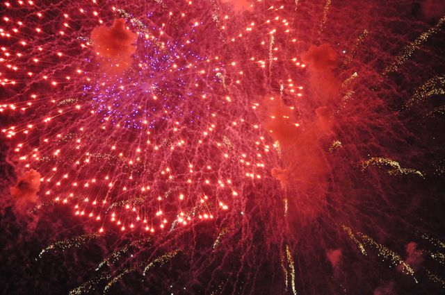 Vibrant Red and Purple Fireworks Exploding Against Night Sky - Download Free Stock Photos Pikwizard.com