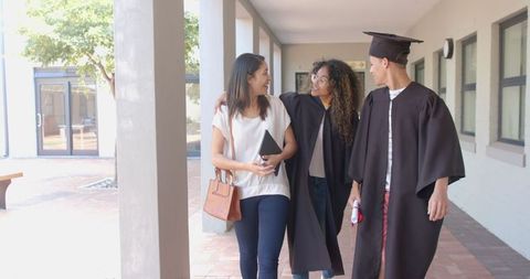 Graduate Celebrates with Family in High School Hallway - Download Free Stock Images Pikwizard.com