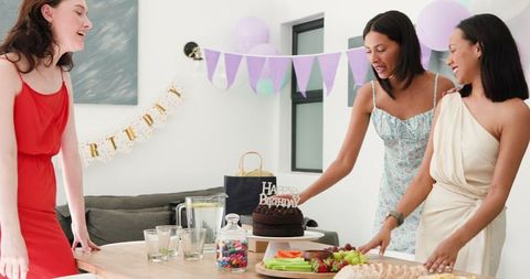 Diverse Friends Celebrating Birthday with Cake and Decorations at Home