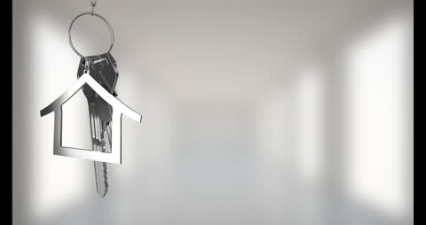 House Key and Keychain in Front of Blurry Background