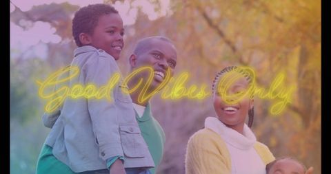 Happy African American Family in Nature with Positive Message