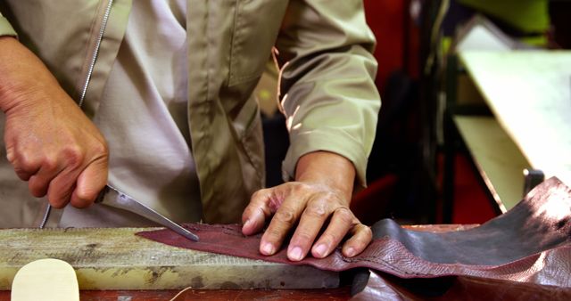 Skilled Artisan Cutting Leather Material in Workshop - Download Free Stock Images Pikwizard.com