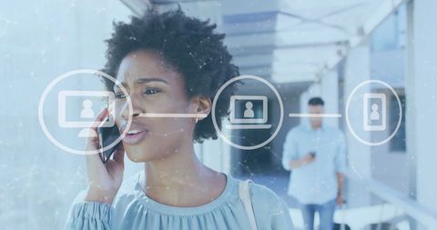 Businesswoman Connecting via Smartphone and Digital Networks in Airport