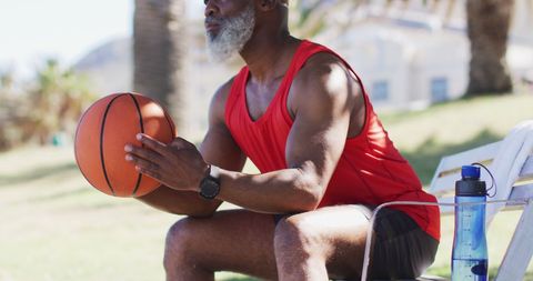 Senior Man Outdoors Holding Basketball in Park - Download Free Stock Images Pikwizard.com
