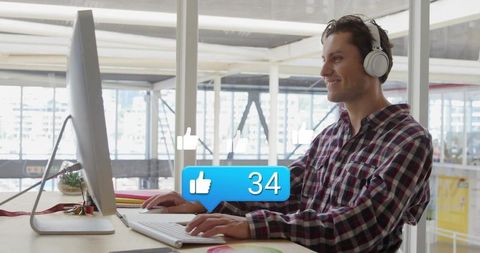 Office Worker Tracking Social Media Engagement at Desk