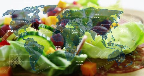 Connecting global food supply: fresh salad with world map and digital data visualization overlay