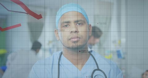 Biracial Doctor Analyzing Digital Data in Hospital Setting