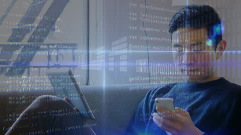 Young Man Engaging with Multiple Devices Amid Digital Data