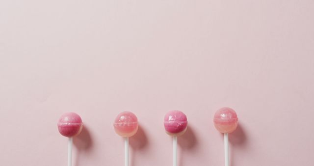 Four Pink Lollipops on Light Pink Background - Download Free Stock Images Pikwizard.com