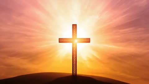 Sunrise Backlighting Ornate Cross on Hill with Radiant Starburst and Golden Halo