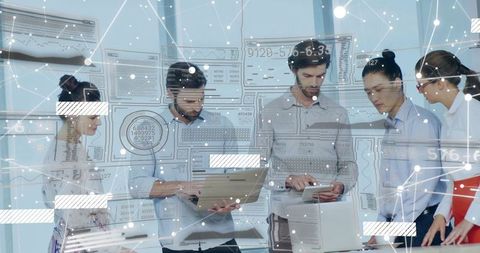 Team Collaborating with Digital Data and Technology Devices in Office