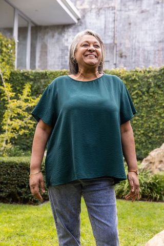 Senior Woman Joyfully Embracing Outdoor Nature