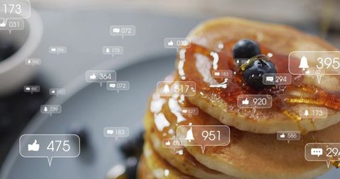 Social Media Notifications Hovering Over Pancake Stack with Maple Syrup and Blueberries