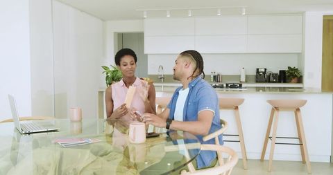 African American Couple Engaging in Domestic Conversation Over Breakfast