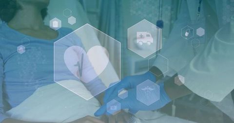 Clinician checking patient pulse in hospital bed with telehealth digital medical hex icons