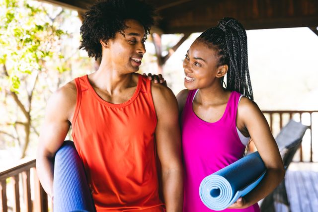 Happy African American Couple with Yoga Mats in Log Cabin - Download Free Stock Images Pikwizard.com