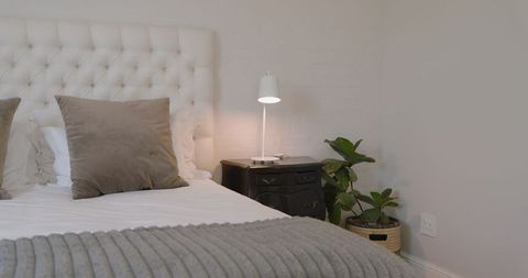 Luxurious and Minimalist Bedroom with White Tufted Bed