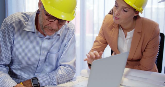 Engineers Collaborating on Construction Project in Office - Download Free Stock Images Pikwizard.com