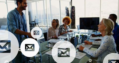 Diverse Business Meeting Analyzing Digital Data in Modern Office