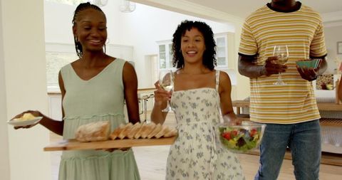 Friends Gathering at Home Sharing Food and Laughter
