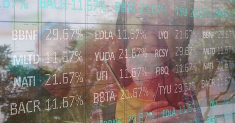 Person Analyzing Stock Market Data on Transparent Screen