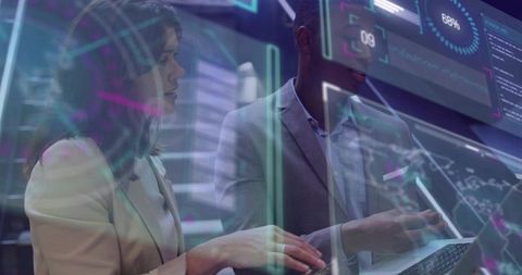 Business team collaborating on futuristic holographic data dashboard with laptop and analytics
