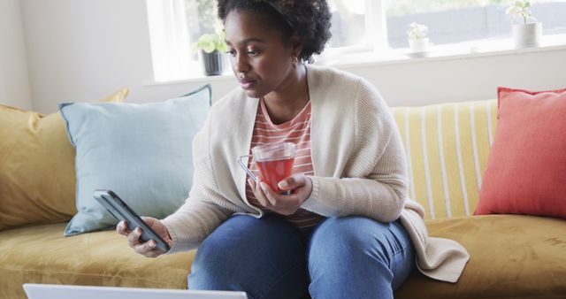 Relaxed Woman Enjoying Drink and Using Smartphone at Home - Download Free Stock Images Pikwizard.com