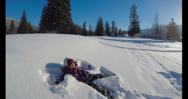 Child Making Snow Angel in a Winter Landscape - Download Free Stock Images Pikwizard.com