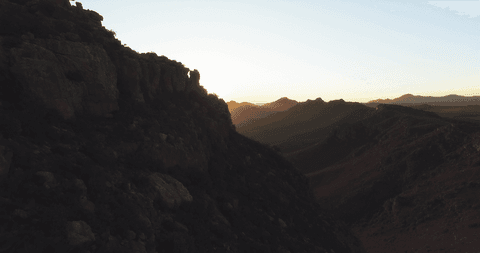 majestic transparent sunset over rocky landscape - Download Free Stock Videos Pikwizard.com