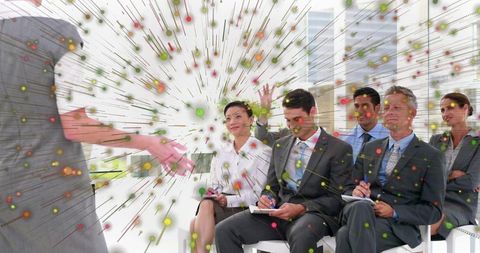 Business audience engaging with presenter in data-driven corporate seminar and training