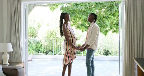 Expecting couple embracing parenthood preparing together