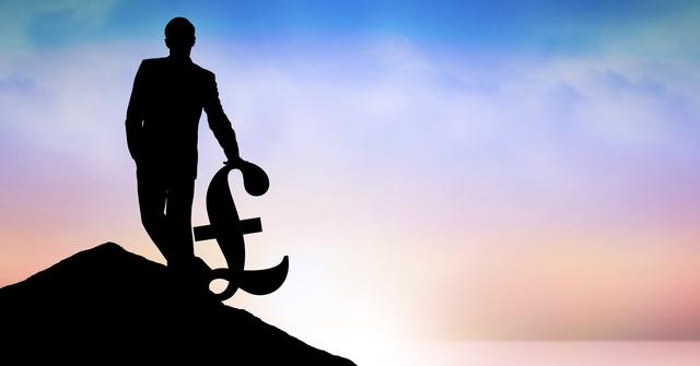 Digital composite of Silhouette businessman carrying pound symbol on peak against sky during sunset