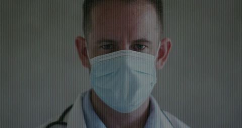 Health professional with mask in medical clinic environment