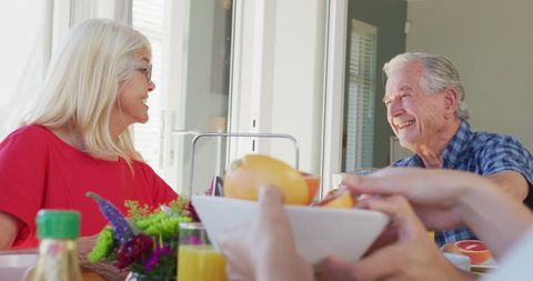 Elderly Couple Smiling and Dining Together Indoors - Download Free Stock Images Pikwizard.com