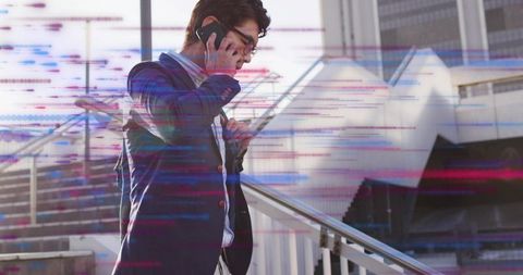 Businessman Talking on Smartphone in Futuristic Cityscape