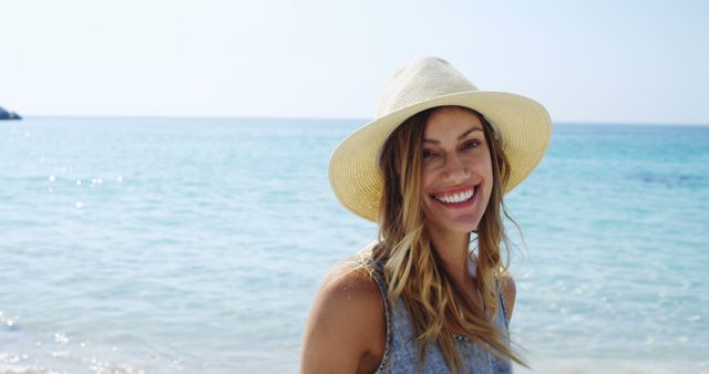 Happy woman enjoying summer vacation on beach - Download Free Stock Images Pikwizard.com