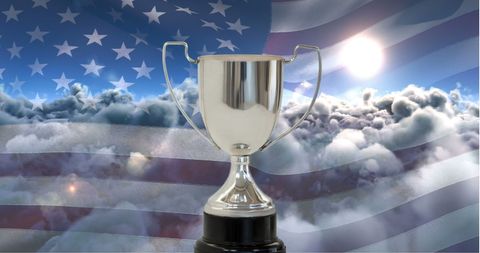 Silver trophy with american flag and cloud background symbolizing achievement