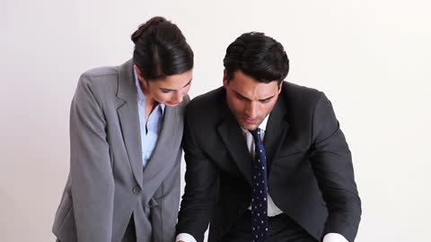 Focused Business Professionals Analyzing Reports