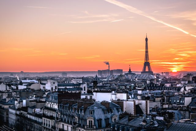 Perfect for travel blogs, promotional content for tourism, posters highlighting Paris landmarks or urban images for hospitality websites. Captures the serene beauty of Paris at dawn with iconic architecture and the Eiffel Tower in silhouette.