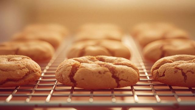 Homemade Cracked-Top Cookies on Cooling Rack with Warm Lighting