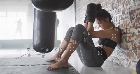 Woman Boxer Resting Against Brick Wall with Digital Analysis Overlay