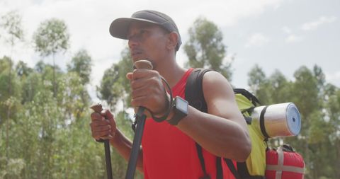 Man Hiking with Poles and Backpack in Outdoor Adventure Scene - Download Free Stock Images Pikwizard.com