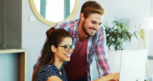 Cheerful Coworkers Collaborating on Computer in Office Workspace - Download Free Stock Images Pikwizard.com