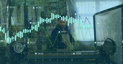 Machinist using tablet in metalworking workshop with real-time analytics overlay