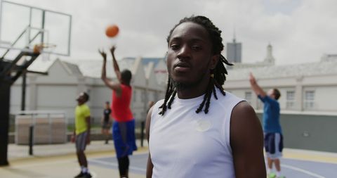 Confident Basketball Player Posing on Outdoor Urban Court